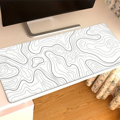 espace travail avec sous main bureau motif courbes noir fond blanc